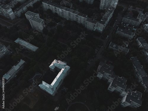 Aerial city roofs top flight in eastern Europe, Ukraine. Multistory buildings scenic dark contrast view