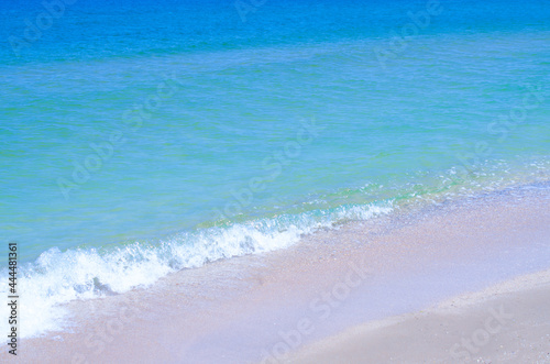 Sandy beach and the sea. Beautiful summer background. Design of photo wallpapers, screensavers, covers.