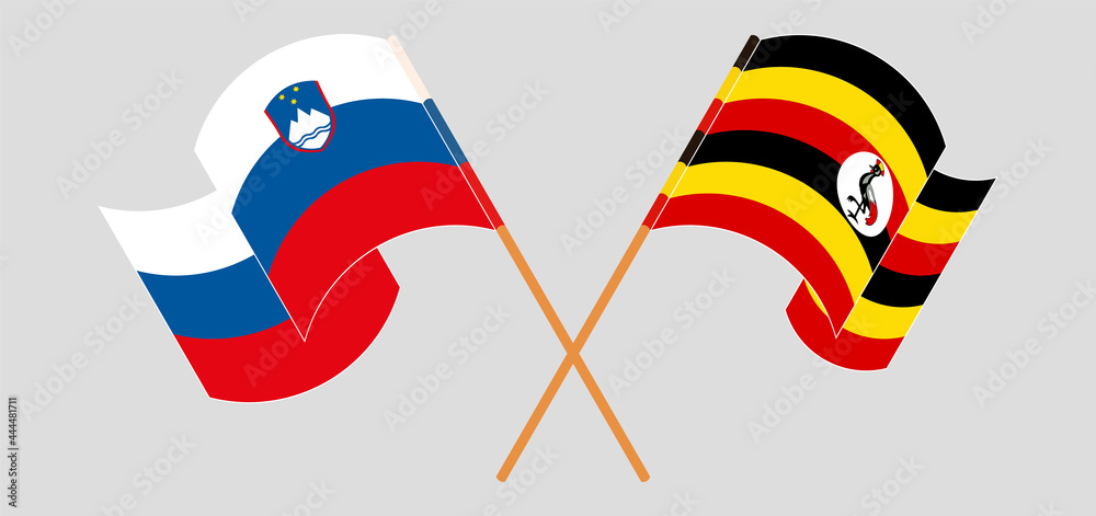 Crossed and waving flags of Slovenia and Uganda Crossed and waving flags of Slovenia and Uganda