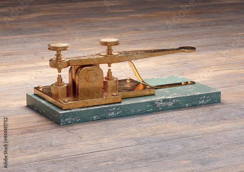 Antique electric telegraph machine isolated on wood table photo