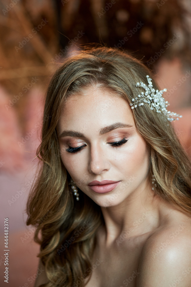 Portrait of a bride with beautiful tanned skin, professional makeup. Handmade hair decoration. Portrait of a bride with beautiful tanned skin, professional makeup. Handmade hair decoration.