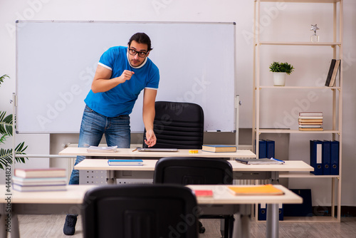 Young male student in the classroom