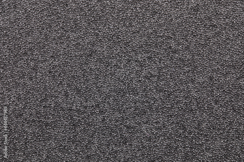 Close up of black sponge texture or surface.