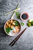 asian rice noodle soup with fried tofu and shrimps