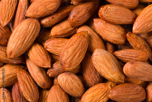 Delicious roasted sweet almonds nuts  background