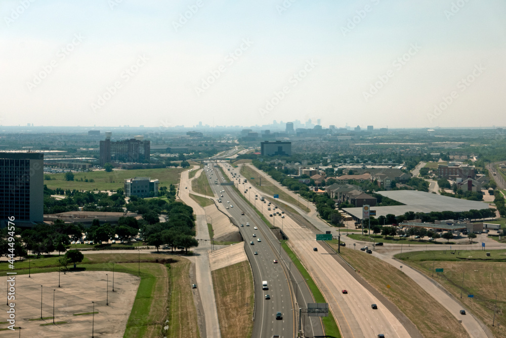 Aerial view of distant downtown Dallas with highway in the foreground