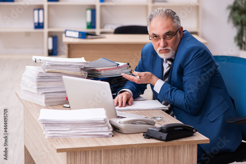 Old male employee and too much work in the office