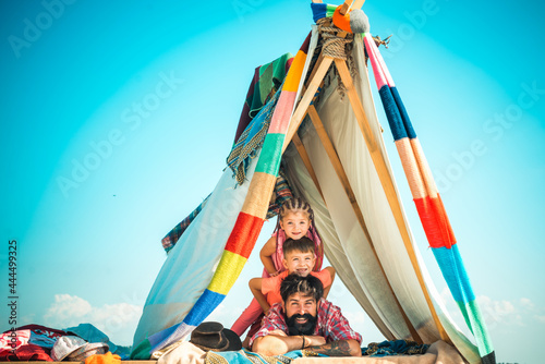 Summer family vacation. Happy father with chidren camping. Fathers day. photo