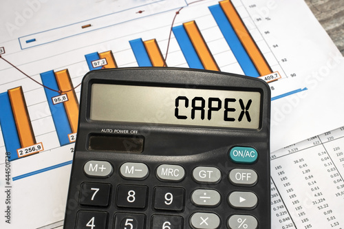 There is a calculator on the financial documents, on the monitor of which the word capex is written. Business and financial concept