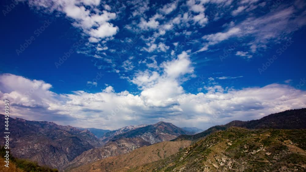 Time Lapse - Beautiful cloudscape moving over mountain rage and the valley Time Lapse - Beautiful cloudscape moving over mountain rage and the valley