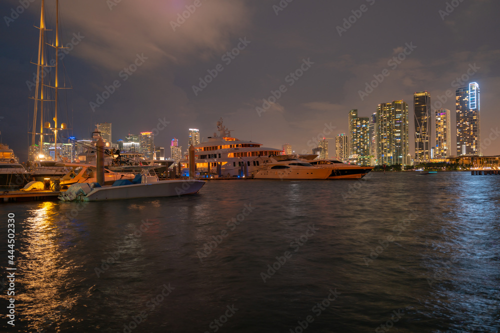 Miami city. Miami skyline panorama at dusk with skyscrapers over sea. Night downtown sanset.