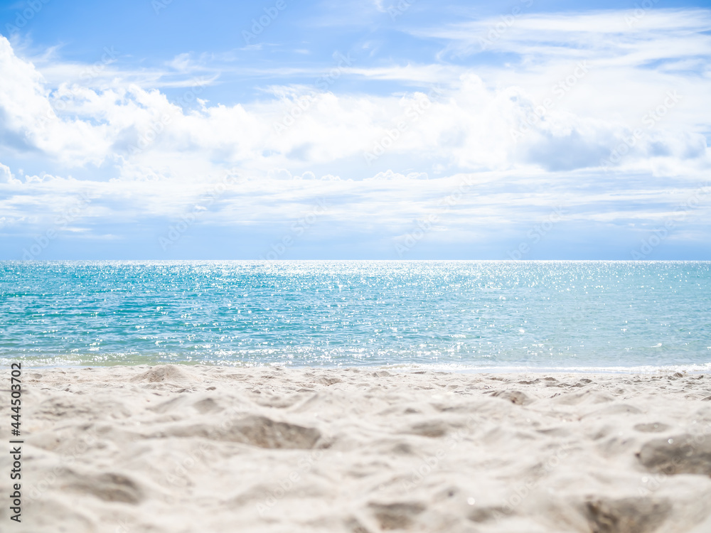 Sand beach coast on blur bokeh blue sea and blue sky in light days. ocean island in thailand nature outdoor. for tourist vacation tropical summer holidays concept. Sand beach coast on blur bokeh blue sea and blue sky in light days. ocean island in thailand nature outdoor. for tourist vacation tropical summer holidays concept.