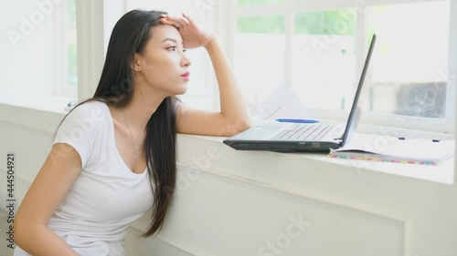 unhapy upset woman working on laptop