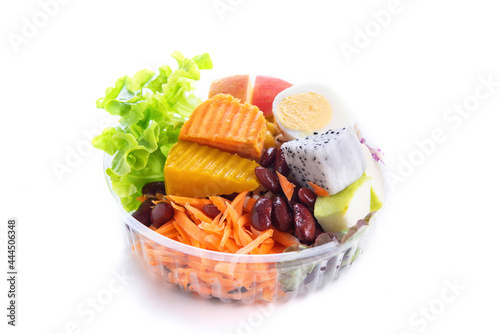 Mixed fruits salad with nuts and egg on white or isolated background.