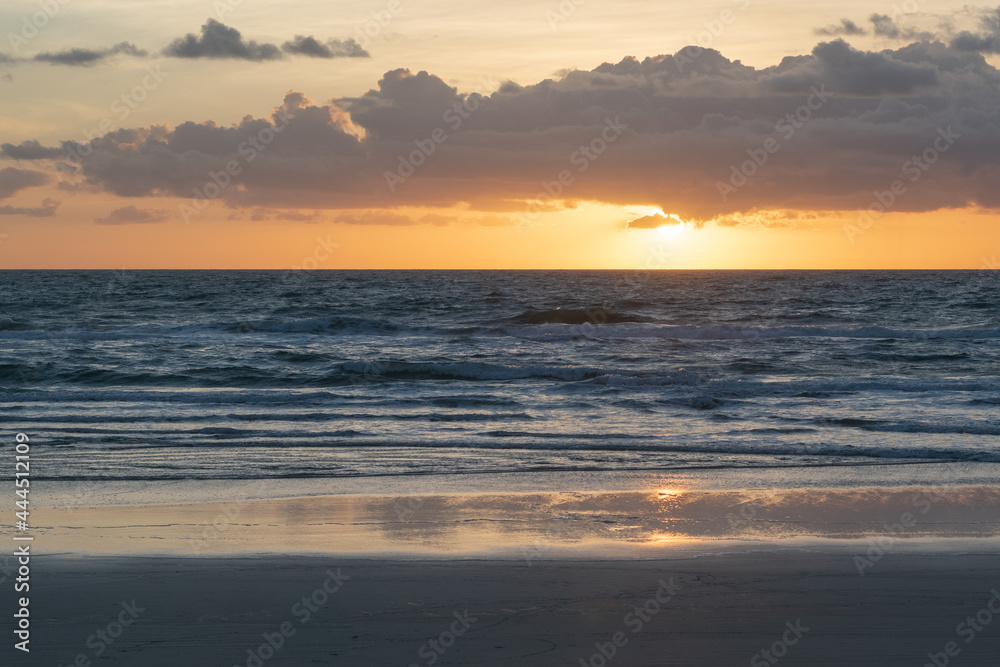 Sunrise over the ocean with beautiful orange and blue tones