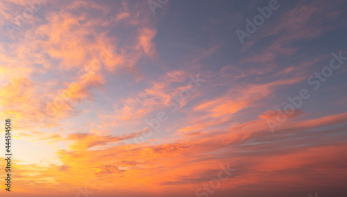 Aerial view sunset sky. Aerial bird's eye. Aerial top view cloudscape. Texture of clouds. View from above. Sunrise or sunset over clouds © Aleksei