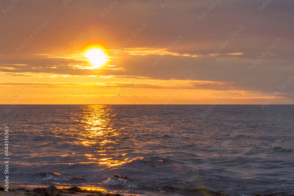 The sun set over the horizon in the baltic sea