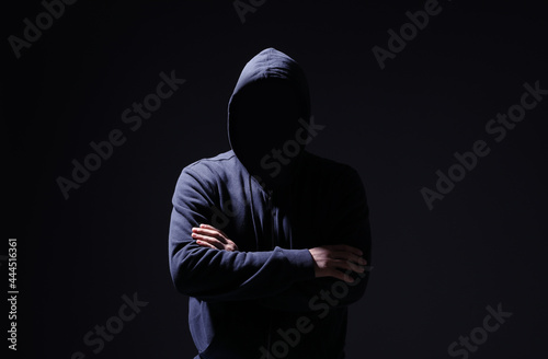 Silhouette of anonymous man on black background
