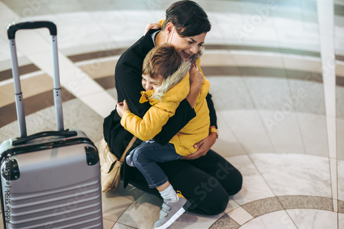 Mother getting emotional with her child at airport