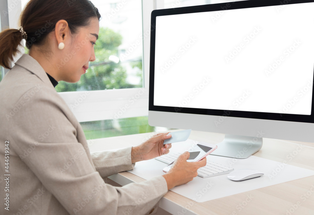 Online phone payment by credit card at home, Asian woman using mobile phone make digital money payment for shopping. E commerce, online banking, mobile app concept. Online phone payment by credit card at home, Asian woman using mobile phone make digital money payment for shopping. E commerce, online banking, mobile app concept.