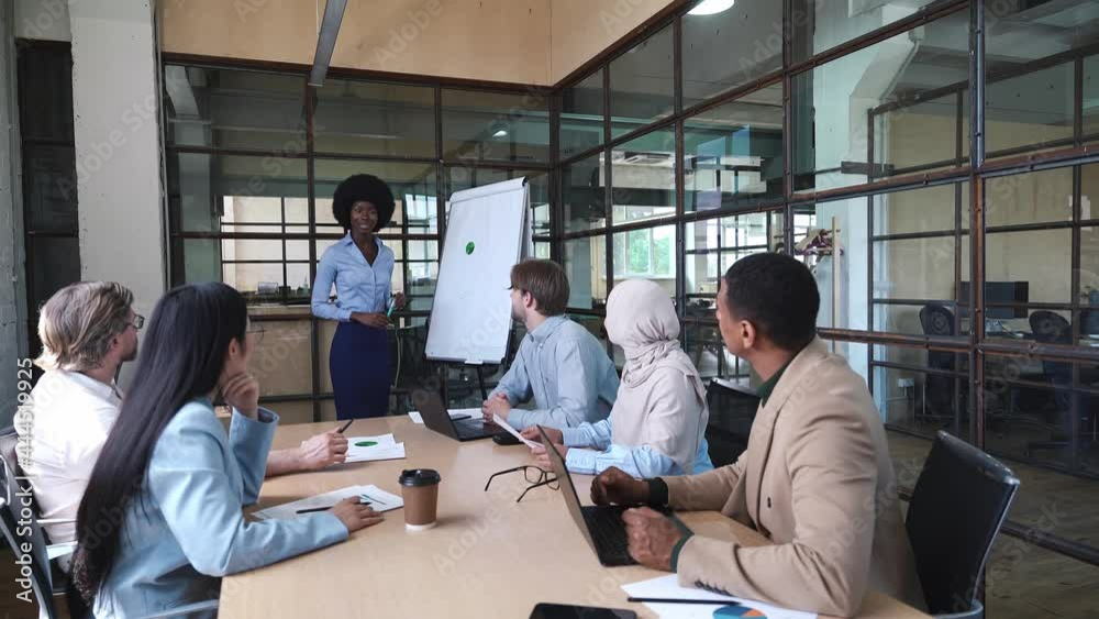 Multiethnic business team at work in their start up industrial office. Multiethnic business team at work in their start up industrial office.