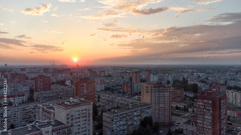 Fototapeta premium sunset over the city view from a height.
