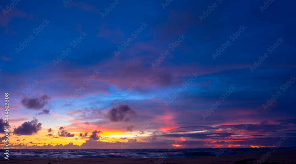 .stunning sunset at the sea in twilight. .Scene of colorful red light trough in the dark blue sky..Gradient color. Sky texture, abstract nature background..