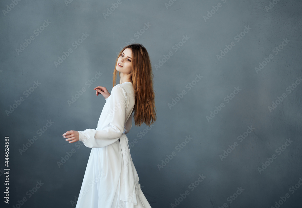 Woman in white dress dance performing dark background Woman in white dress dance performing dark background