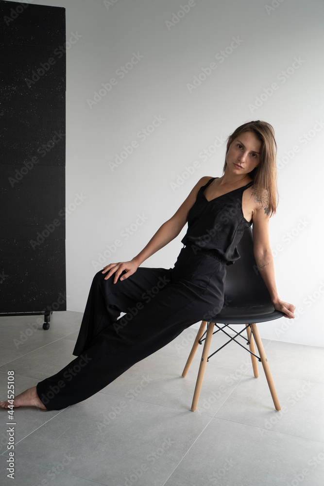 woman sitting on a chair woman sitting on a chair