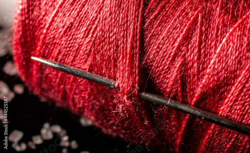 Spool Of Red Thread With Needle macro