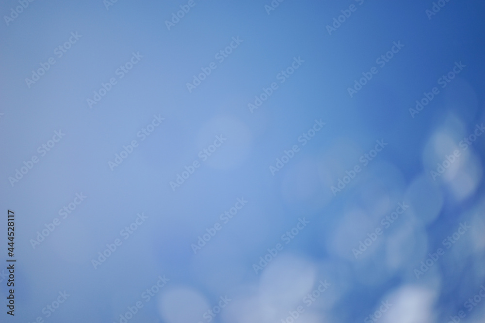 Bokeh lights in blue and white colors. Abstract background. Bokeh lights in blue and white colors. Abstract background.