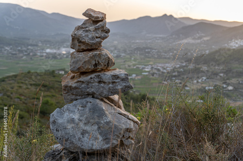Close-up of some stones stacked on a path to guide hikers and walkers.  © MiguelAngel