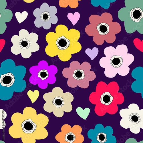 Seamless background with childish floral pattern. Flowers and hearts different bright colors on a dark purple background. Floral baby background in flat style for printing on fabric, wallpaper, paper
