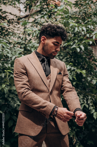 business suit on a dark-skinned man, tuxedo, three-piece suit