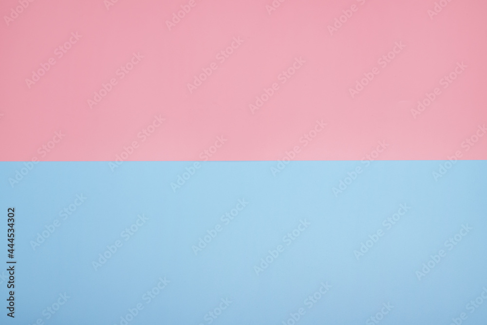 Fototapeta premium Blue and pink paper background. copy space.