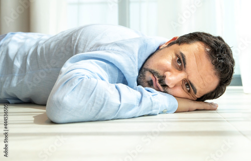 depressed middle aged arab man on a floor