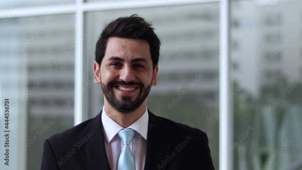 Smiling professional businessman. Happy confident handsome smart young adult entrepreneur, leader, manager posing in the office. Close-up face view business portrait. Smiling professional businessman. Happy confident handsome smart young adult entrepreneur, leader, manager posing in the office. Close-up face view business portrait.