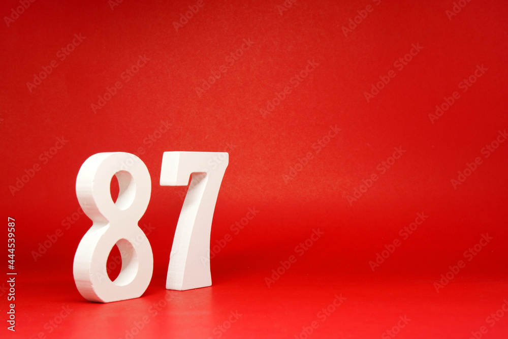 Eighty Seven ( 87 ) white number wooden Isolated Red Background with Copy Space - New promotion 87% Percentage Business finance Concept Eighty Seven ( 87 ) white number wooden Isolated Red Background with Copy Space - New promotion 87% Percentage Business finance Concept