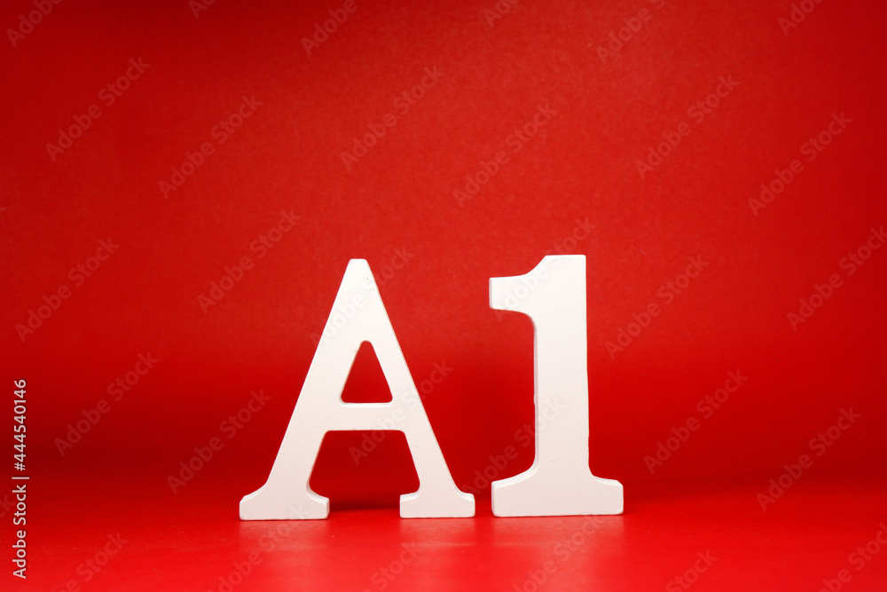 A1 white letter word wooden Isolated Red Background with Copy Space - Advertise object symbol or Education Concept A1 white letter word wooden Isolated Red Background with Copy Space - Advertise object symbol or Education Concept