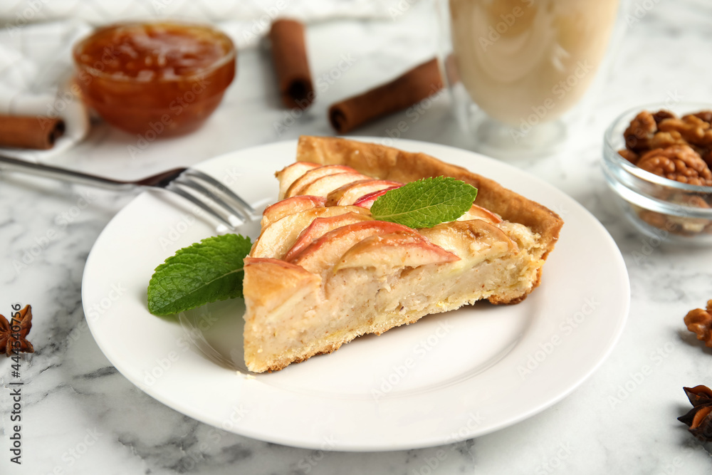 Slice of delicious apple pie on white marble table Slice of delicious apple pie on white marble table