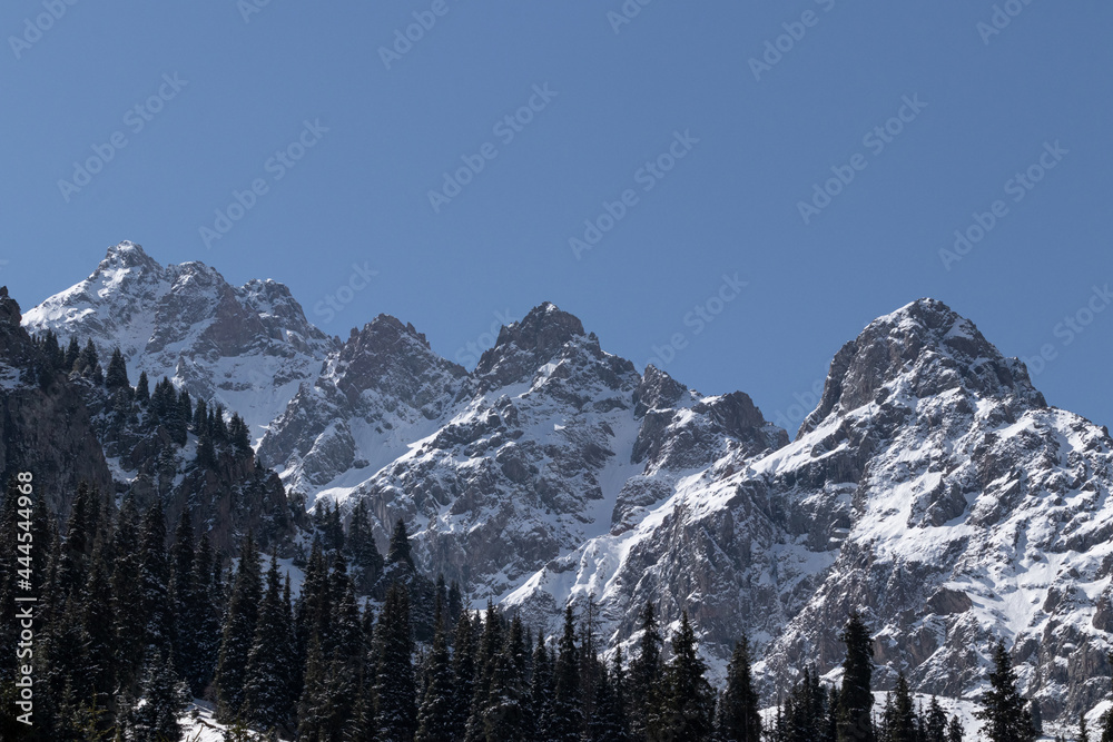 View of large mountain rocks in the snow