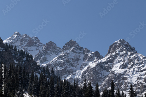 View of large mountain rocks in the snow
