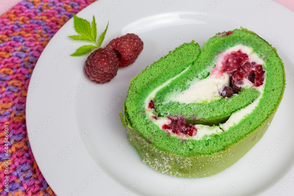 green matcha roll cake with cream cheese and fresh raspberry green matcha roll cake with cream cheese and fresh raspberry