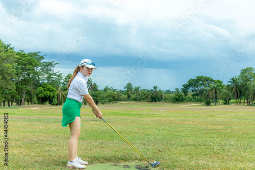 female athlete practicing golf for competition