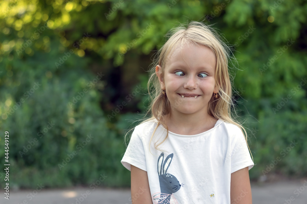 portrait of a funny child, blonde 6 years old, toothless preschool girl, smiles and rolls her eyes, she has no upper teeth in her mouth, photo of a cheerful girl, with slanted eyes portrait of a funny child, blonde 6 years old, toothless preschool girl, smiles and rolls her eyes, she has no upper teeth in her mouth, photo of a cheerful girl, with slanted eyes