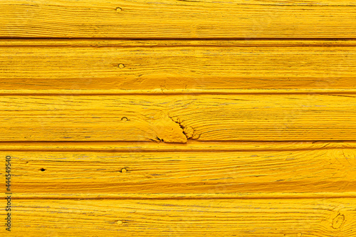 background of wooden boards painted with yellow paint