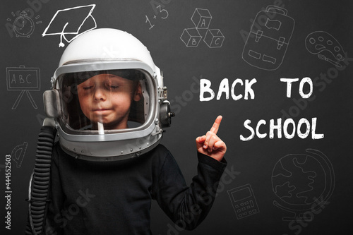 The child plans to go back to school wearing an astronaut helmet to become an astronaut