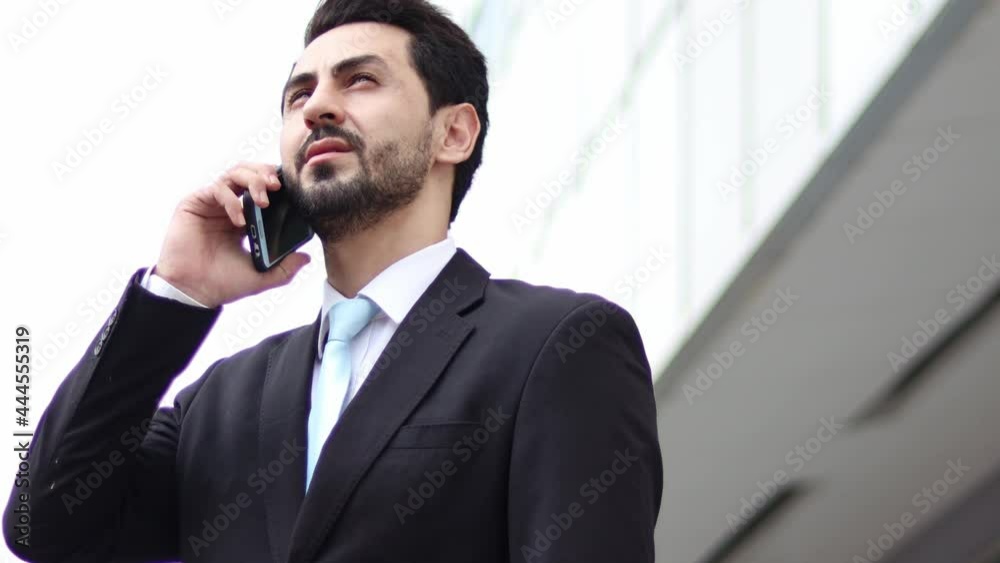 Handsome businessman using a mobile phone. Young man texting Messages, Social Networking. People. Apps. Handsome businessman using a mobile phone. Young man texting Messages, Social Networking. People. Apps.