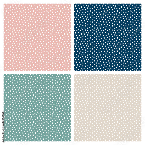 Vintage Polka Dot vector seamless pattern set. White irregular dots, scattered various shape spots on pink, beige, green and blue background. Texture for nursery print design, fashion textile, fabric