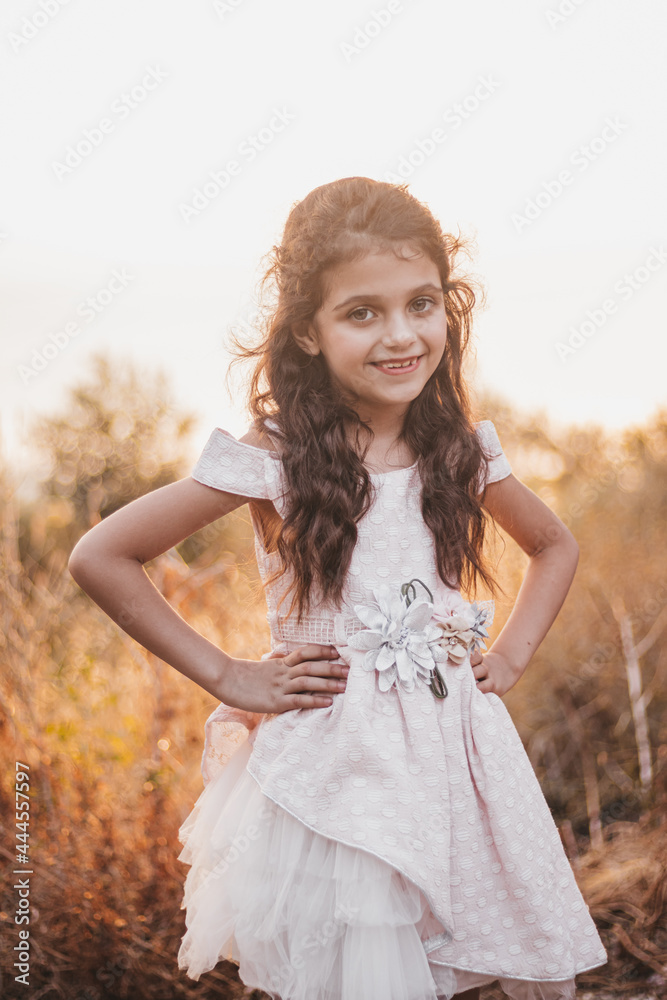 Portrait of a smiling little girl posing to the camera